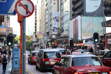 Red taxis on a busy Hong Kong street
